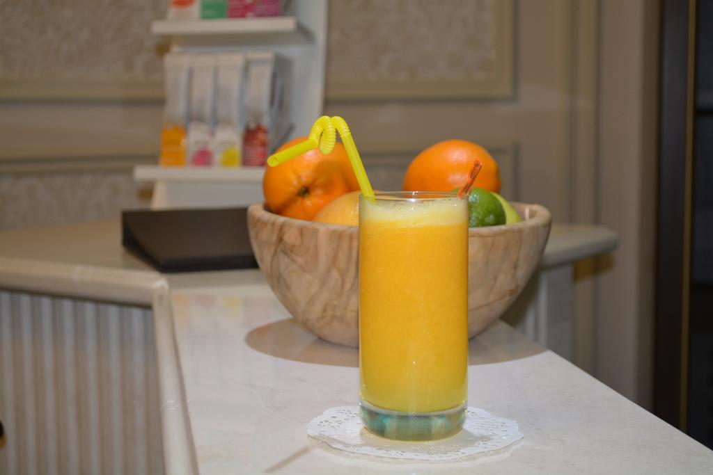 Rixos Khadisha Shymkent Hotel Екстериор снимка A glass of orange juice